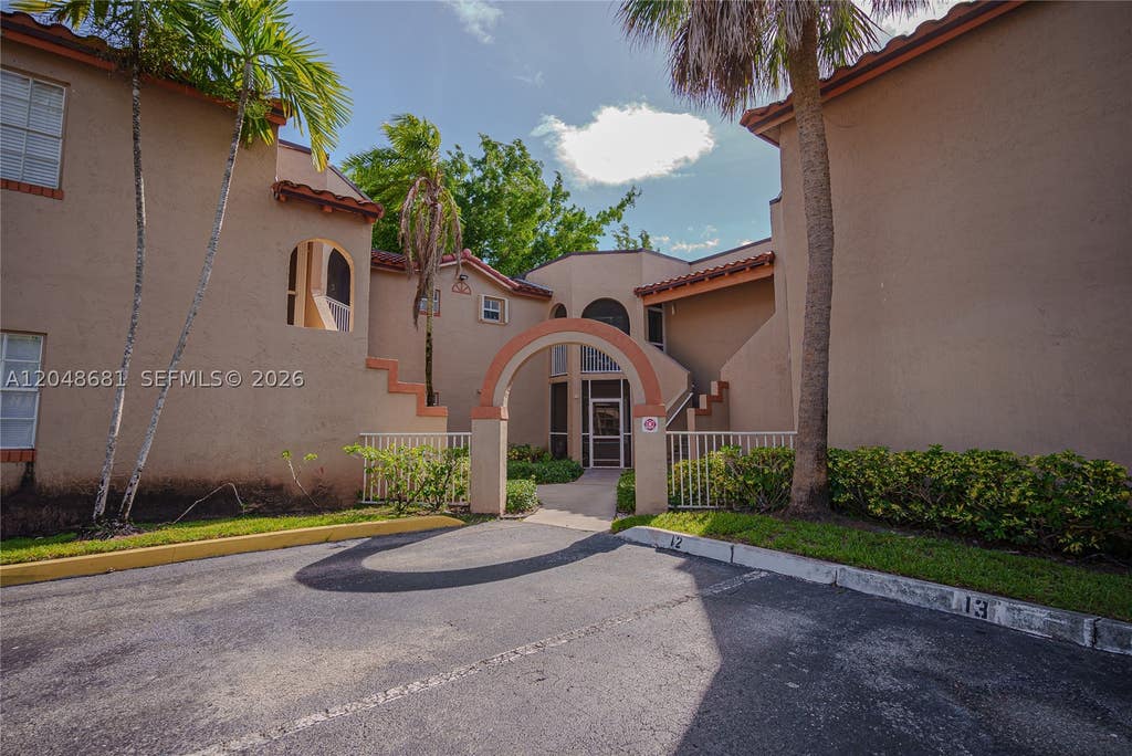 Photo of 8630 SW 3rd St #102, Pembroke Pines, FL 33025 (MLS # A12048681)