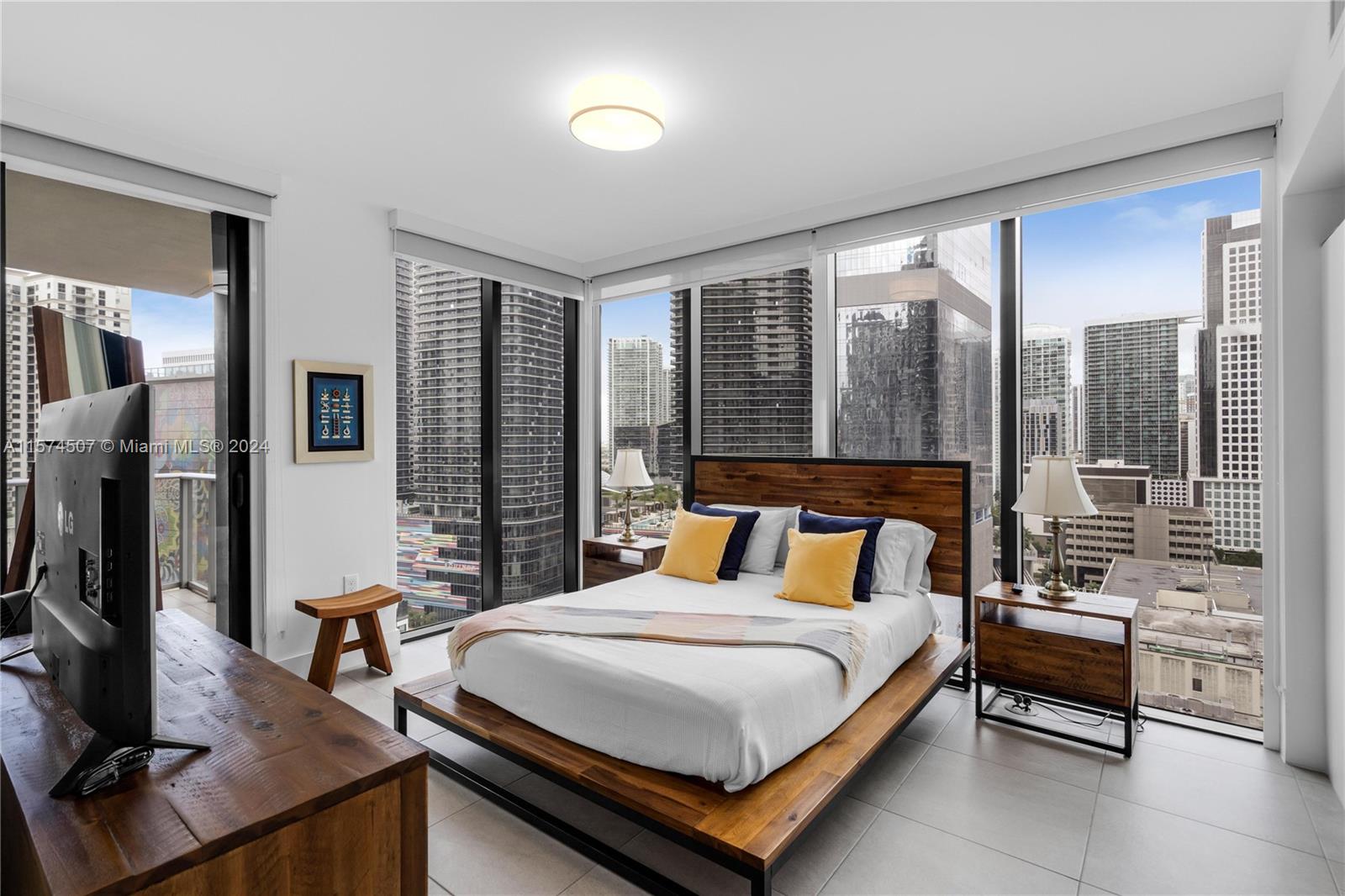 Luxurious corner unit located at 1010 BRICKELL. A 50-Story, luxury high-rise. Light-filled. 1 bedroom + 1 den Gourmet Style Kitchen, complete with top-of-the-line Smeg appliances. Open-concept living area with porcelain tile floor. Master room overlooking the skyline. Additional den perfect for a home office. Amenities includes: rooftop lounge, BBQ and swimming pool located on the 50th floor. Indoor swimming pool next to the fitness center with yoga/aerobics room. Kids playground with bowling alley, pin pong, private social room for adults with virtual golf simulator, basketball and racquetball courts, outdoor running track. Spa includes warming hammam, hydrotherapy, cold plunge, hot/cold Jacuzzi, massage room, sauna and steam room. Unit is being sold Furnished.