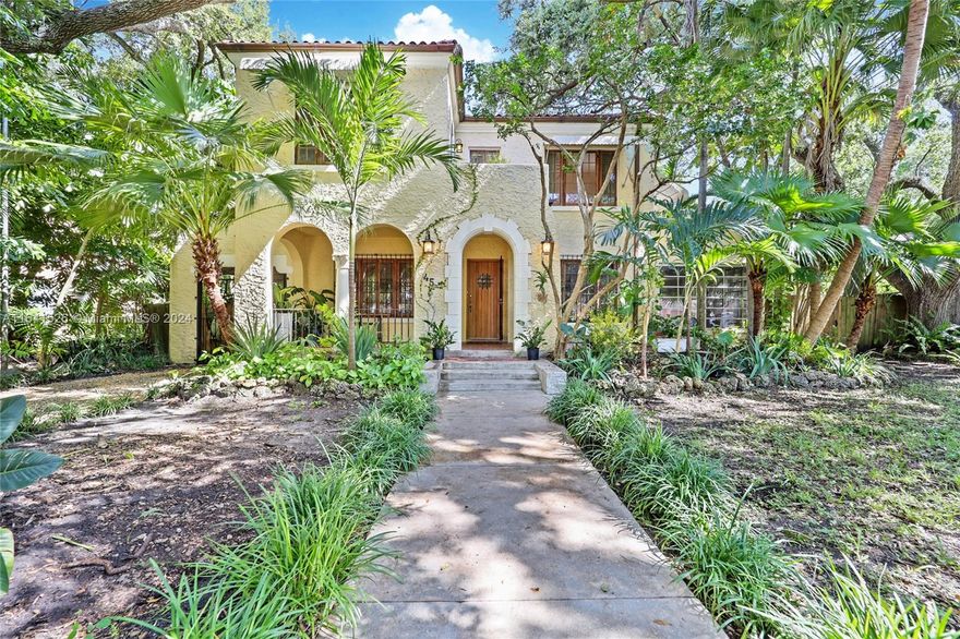 Elegant 1926 Mediterranean Revival Home & Cottage on a Buildable Double Lot in Buena Vista East steps from the Design District.The exterior showcases classic Mediterranean elements with stucco siding,a spanish-tiled roof and arched doorways.Step into the expansive living room which features high beamed ceilings,a stunning fireplace with intricate tile work and arched windows that bathe the space in natural light.The formal dining room is adorned with classic moldings and a graceful chandelier, ideal for elegant gatherings.The updated chef’s kitchen marries modern functionality with historic charm, boasting custom cabinetry, with a cozy breakfast nook and butler's pantry,a perfect spot for morning coffee.Upstairs, the luxurious master suite includes a private balcony overlooking the gardens