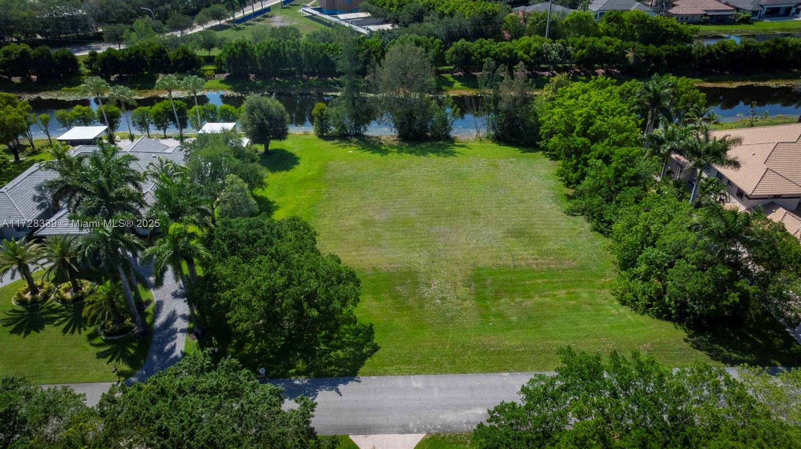 Rare to find vacant lot in exclusive Windmill Lake Estates in Weston, Florida. It is one acre of land with a rectangular shape and private back facing the lake. Windmill Lake Estates is an upscale, gate guarded boutique community of only 58 sites of custom estate homes