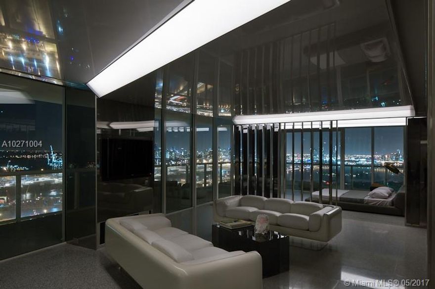 Sleek, modern and minimal. This glass house is remarkable at capturing it's environment. Written up in the Wall Street Journal and Wallpaper Maginze, this custom 3 bedroom home feels like a yacht suspended 370 feet in the air. With moving glass walls and levers, the home is in constant rhythm with its surroundings. Equipped with state-of-the-art Crestron system automatic blinds and sound throughout. Master bathroom has a steam shower, auto drying soaking tub. Custom terrazzo flooring. Large walk-in closet. The ICON is a full service luxury building with private restaurant, world class gym, 2 pools, 24 hour front desk, valet and more.