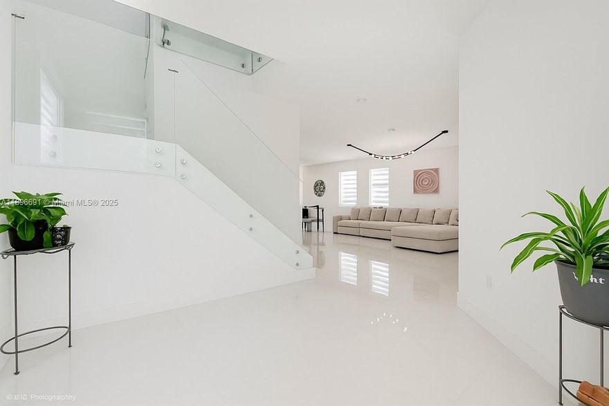 Want to have the most beautiful property in the Homestead market? Experience modern living in this beautifully remodeled home featuring an open-concept design with brand-new porcelain floors and matching porcelain baseboards made to last forever. Enjoy the elegant glass staircase, updated walk-in shower, and a paved patio ideal for entertaining. A spacious driveway plus a 2-car garage. Located in a gated community right off Turnpike exit 9, residents enjoy resort-style amenities including a clubhouse, pool, basketball courts, and a scenic lake with walking paths. Truly move-in ready and built for comfort and style.