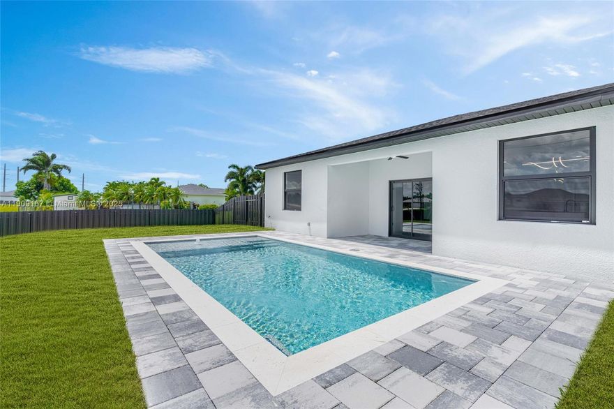 Move-in ready NEW construction pool home in Cape Coral! Just steps from Santa Barbara Blvd, this stunning Roma model sits on a premium corner lot and features high ceilings, 3 spacious bedrooms, 2 stylish bathrooms, and a 2-car garage with  driveway. Interior highlights include porcelain tile throughout, impact windows and doors, LED lighting, and a bright open layout. The kitchen offers a quartz waterfall island, sleek cabinetry, and stainless steel appliances perfect for entertaining. Bathrooms include designer finishes; the primary bath has a double vanity and glass shower. Enjoy your private pool and deck ideal for relaxing or hosting. Built with quality craftsmanship and located near top-rated schools, dining, shopping, and parks. Great for families, investors, or as a second home.