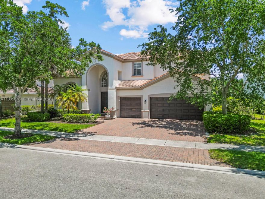 Welcome to this waterfront 5 bed, 5 bath estate in the gated community of Isles at Weston. Perfect for multigenerational families with a bedroom and full bath downstairs. The home features volume ceilings, a cabana bath, ample storage space, dedicated laundry room, and a 3-car garage. The generous floor space allows for separate living, dining, and family rooms. Beautiful water views from the kitchen. Enjoy the cozy loft, a fantastic space for the kids to make their own. Fall in love with the oversized primary bedroom and its incredible water view, dual walk-in closets, and spacious bathroom. An additional ensuite bedroom and Jack-and-Jill bath await you upstairs. Step out onto the covered patio to your backyard oasis. The heated pool and serene water view with fire pit area are perfect for entertaining.