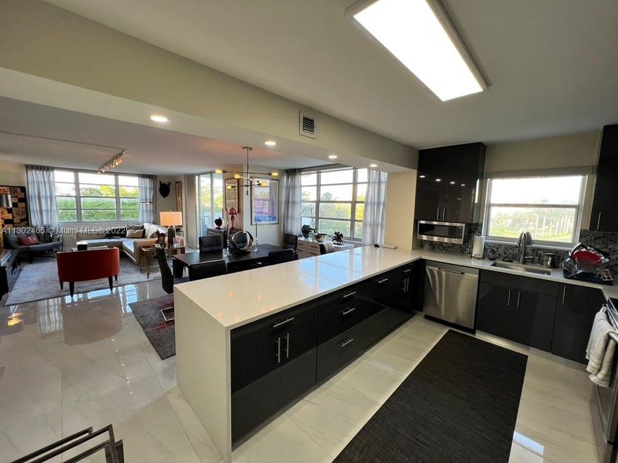 Stunning remodeled corner unit with direct unobstructed bay views. Immaculately well kept interior, east facing balcony with beautiful sunrises. Open floor plan with living room, dining area and amazing kitchen overlooking the bay including new appliances and island kitchen counter top. Walk in fitted closets. Includes an exterior storage cage. This open and airy condo needs no work, it is move in ready and will feel like home immediately.