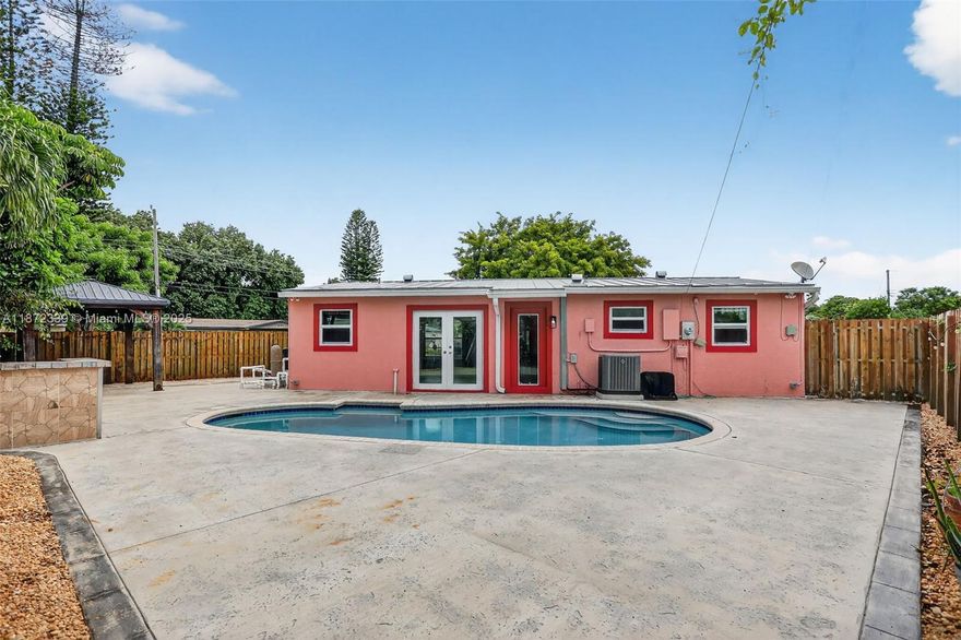 ***SELLER FINANCING AVAILABLE*** BAD CREDIT NO PROBLEM!!! RENT TO OWN OPTIONS AVAILABLE!!! BEAUTIFULLY UPDATED 3 BEDROOMS AND 2 BATHROOMS POOL HOME CENTRALLY LOCATED IN MARGATE! OPEN FLOOR PLAN WITH TILE FLOORS THROUGHOUT, KITCHEN FEATURES GRANITE COUNTERTOPS AND WOOD CABINETS. UPDATED BATHROOMS. BRAND NEW TOILETS AND VANITIES, FRESHLY PAINTED INTERIOR, NEW BASEBOARDS, CORNER LOT WITH LARGE FENCED BACKYARD, WITH SALTWATER SYSTEM POOL AND NICE PATIO.  HIGH IMPACT WINDOWS AND FRENCH DOORS TO POOL, NEW AC 2023. NEW METAL ROOF 2021. PAVED DRIVEWAY. NO HOA!! THIS HOUSE WILL NOT LAST!!