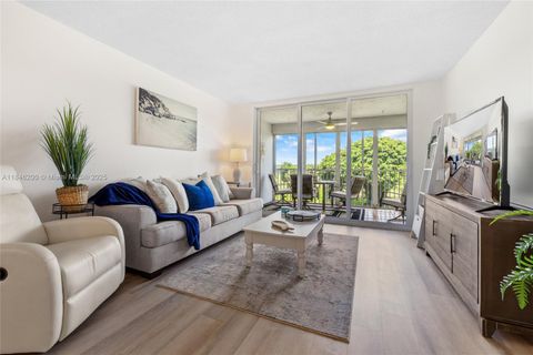 Photo of 2601 S Course Dr #404, Pompano Beach, FL 33069 (MLS # A11846200)