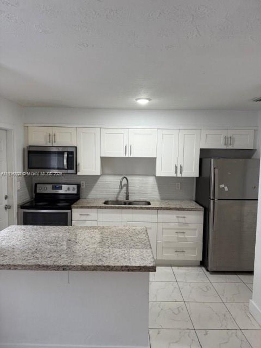 Rent this beautiful and ample 2-bedroom/2-full bath condo only 2 miles from Hollywood Beach and Hollywood Young Circle -  , completely updated and remodeled bathrooms, floors, etc., stainless steel modern refrigerator and newer appliances in a totally remodeled kitchen.