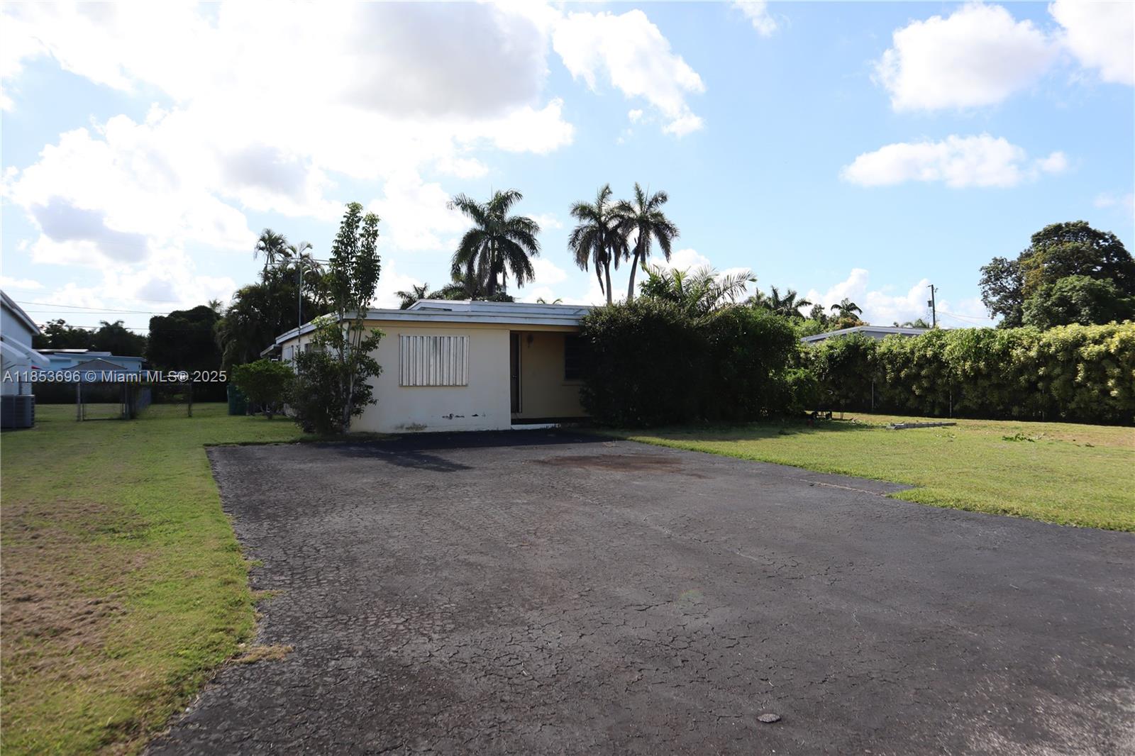Great Opportunity in the Heart of Homestead! This 3-bedroom, 2-bathroom home offers incredible potential with a new roof (2023), oversized lot, and no HOA. Large screened-in patio—perfect for relaxing or entertaining (needs some repair). With plenty of room to make it your own, this handyman special is being sold as-is. Don’t miss your chance to own a property with endless possibilities!