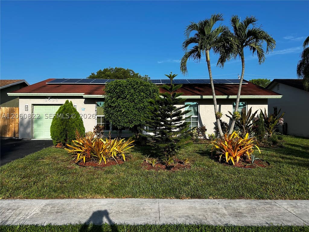 Photo of 2403 NW 108th Ter, Sunrise, FL 33322 (MLS # A12060822)