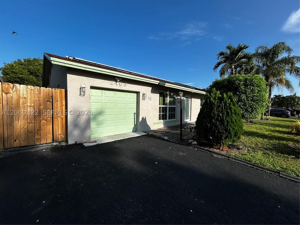 Photo of 2403 NW 108th Ter, Sunrise, FL 33322 (MLS # A12060822)