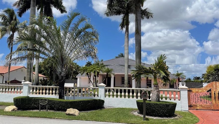 A 39,204 SQF lot in the heart of JG HEADS FARM. 
Total more than 6,430 Sq Ft   Year Built  1986
Two-Story home sitting on Magnificent Contemporary 
 Corner Lot with four different entrances, remote controlled for gate on drive way and new roof installed. 
Astounding backyard with picnic and tropical landscaping, mini golf entertainment area. Pool with salt water and heater system, sauna, spacious living area, bar, open kitchen, wood cabinets, granite counter top, marble floors, alarm, crown molding, intercom, generator, gas water heater system, and more. Horses are welcome. Call today