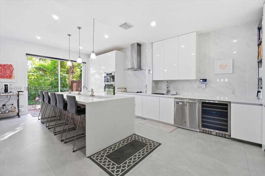 Beautifully upgraded home in the exclusive Doral Isles community! featuring a rare expanded and fully renovated kitchen (2020) that creates a true open-concept living space unique for this model and perfect for entertaining. This spacious layout includes 4 bedrooms + den. The fourth bedroom was added and is a full, functional room with windows and closet. The first floor offers a convenient full bedroom and bathroom, ideal for guests or multigenerational living. Upstairs you’ll find 3 bedrooms, 2 bathrooms, and a versatile den. The home features accordion shutters, no carpet, porcelain flooring on the first level, and laminate wood flooring upstairs. Enjoy a private backyard with a pleasant garden view, perfect for relaxing or outdoor gatherings. Located in one of Doral’s most sought-after gated communities with resort-style amenities: clubhouse, pools, gym, playgrounds, courts, and more. Easy to show!!! this upgraded and well-maintained home is truly one of a kind. Bring your buyers!