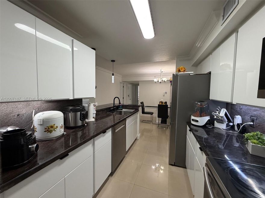 Beautiful, bright, and spacious 2-bedroom, 2-bathroom apartment located on the second floor. This modern unit features a sleek contemporary design with stainless steel finishes, wood cabinetry, and elegant granite countertops. The appliances are relatively new, and the unit includes a full-size washer and dryer, also recently purchased, conveniently located inside. Porcelain tile flooring runs throughout, complemented by impact-resistant windows that provide both safety and natural light. Enjoy a generously sized balcony. Water is included in the rent. The community offers security patrol, a swimming pool, and a children's playground. Situated in an excellent neighborhood with top-rated
schools nearby. The primary bathroom includes a walk-in shower, second bathroom features a jacuzzi tub.