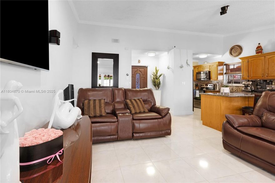 $5,000 Buyer Credit for closing! Welcome to this stunning 3-bedroom, 2-bathroom single-family home situated in the vibrant South Miami Heights. Covering 1,306 square feet, this residence showcases modern finishes and a carefully considered design. The property sits on a 4,000 square foot lot and features elegant tile flooring, a stylish wood kitchen, and beautiful granite countertops. High ceilings and large windows fill the home with natural light. The backyard includes a convenient storage shed and a covered patio complete with an outdoor cooking area, perfect for enjoying the beautiful outdoors. Don’t miss your chance to own this exceptional property in a sought-after Miami location!