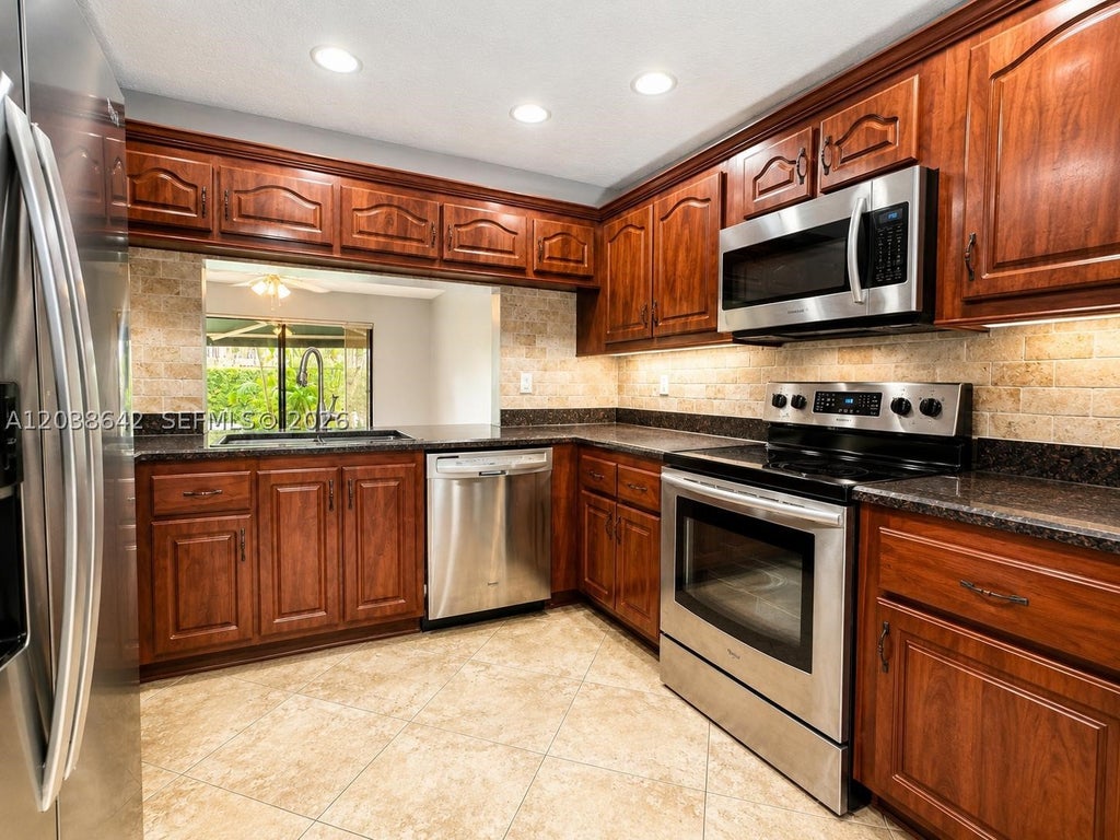 Photo of 5476 Gate Lake Rd #5476, Tamarac, FL 33319 (MLS # A12038642)