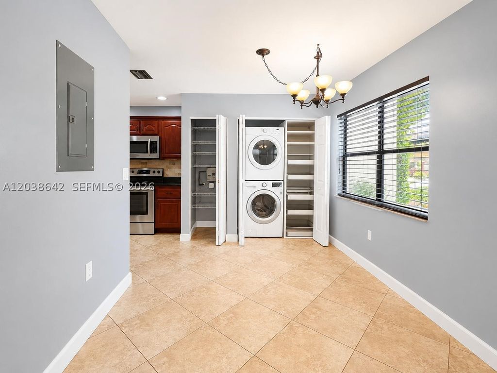 Photo of 5476 Gate Lake Rd #5476, Tamarac, FL 33319 (MLS # A12038642)