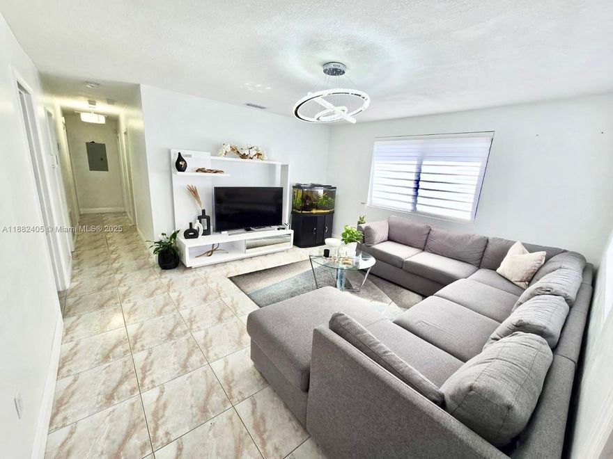 Welcome to this spacious and inviting 4-bedroom, 2-bathroom home, offering the perfect blend of comfort and convenience. Located in a quiet, family-friendly neighborhood, this home is ideal for growing families or anyone who needs extra space.  New Roof, impact windows and doors, tile throughout, updated bathrooms, and updated kitchen with stainless steel appliances.  Master Bedroom can be easily converted to an in-law quarters.  Large backyard with cover terrace truly made for gatherings!
