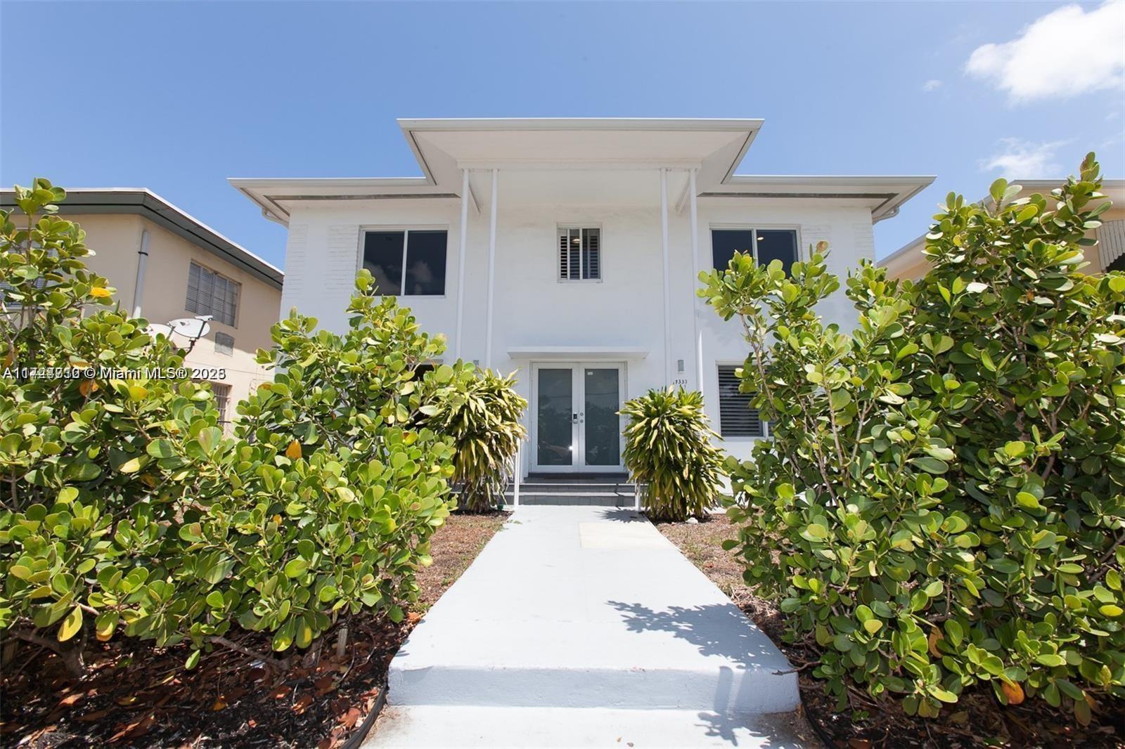 Welcome to this stunning contemporary triplex in a prime Miami Beach location, just across from Garden Park. This 2-story multifamily building features three units: a 4-bedroom, a 2-bedroom, and a 1-bedroom, all fully renovated and income-producing. $600,000 exquisite renovation, resulting in a bright and modern aesthetic with porcelain floors, sleek white and grey decor, and all-new, top-of-the-line open kitchens. Every inch of this property has been carefully updated, including impact glass windows and thoughtfully designed floor plans. For investors, this triplex offers an impeccable instant cash flow, making it a rare and unique opportunity in the vibrant most upcoming North Beach real estate market.