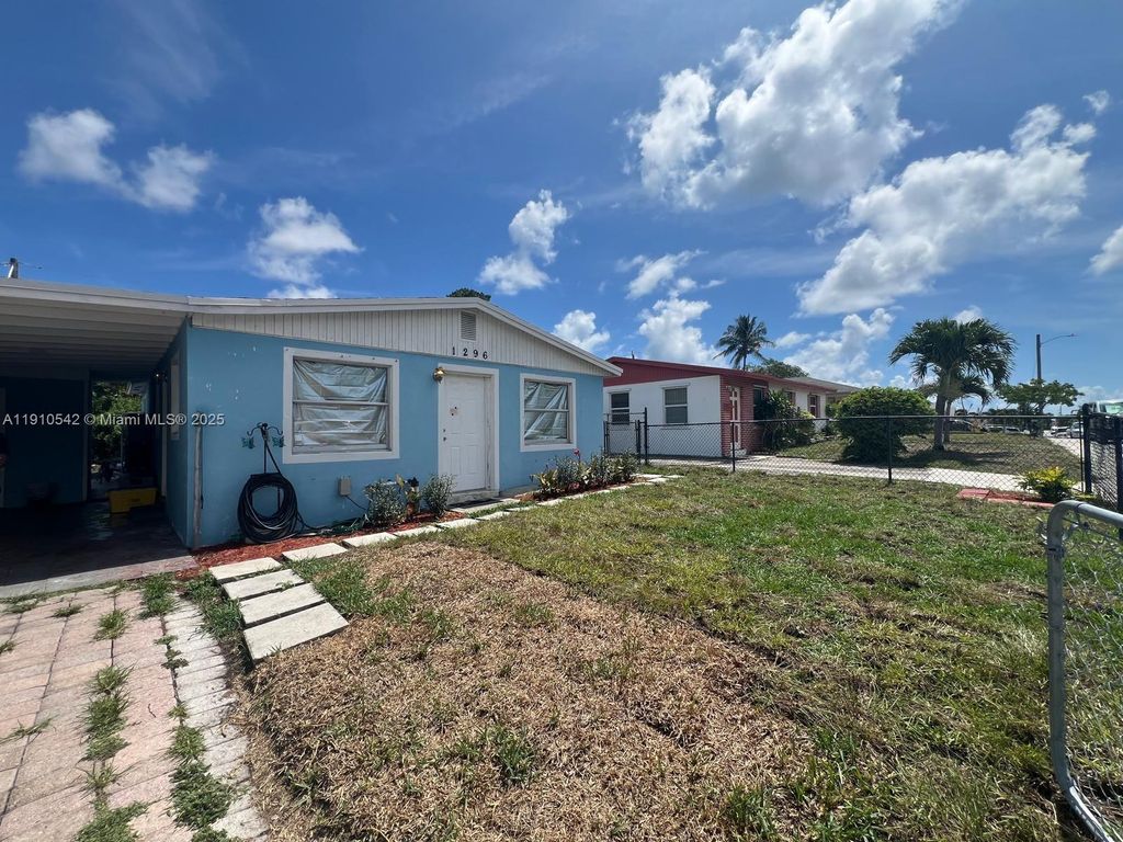 Photo of 1296 W 36th St, Riviera Beach, FL 33404 (MLS # A11910542)