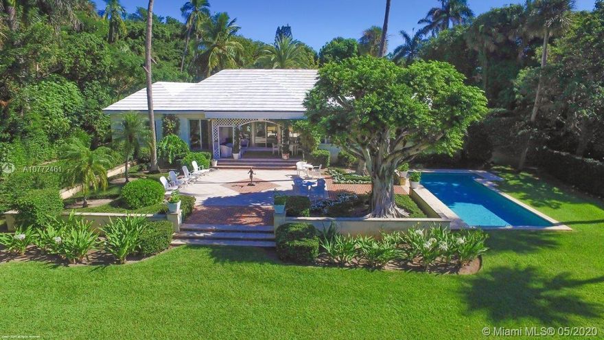 Be amazed at the tropical beauty of the 2.5+/- acre estate comprised of two deep parcels that provide ocean access with 131+/- feet of private beachfront and just enough riverfront to enjoy spectacular Florida sunsets reflecting off the Intracoastal.  Its charming courtyard entry invites visitors in with a warm welcome. The classic Bermuda-style main house includes 3-bedrooms, 5.5-baths exuding understated elegance that is found throughout Jupiter Island. Treasured cypress walls and terracotta tile floors are featured in the main living areas with parquet flooring in the formal dining room and bedrooms. Step outside to the delightful covered lanai and terrace with pool nearby, all overlooking the vast lawn and riverfront.  The property also includes a very private separate guesthouse.