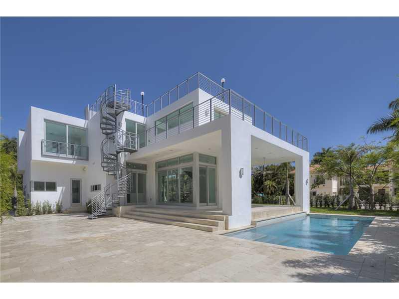 Gated exclusive Hibiscus Island, Miami Beach. Brand new ultra-modern design luxury home w/ top of the line finishes & pool with limestone flooring. Completed May 2015; Foyer entrance has dramatic 26 ft. ceiling. 11 ft. ceiling throughout home. Wall to wal l 36"x 36" Italian Carrara marble floors, 4 beds/4 baths upstairs with water views from terraces & custom walk in closets, 1100 sq.ft. lighted roof top terrace & incredible panoramic views. 1 bed/1.5 baths downstairs. Fabulous indoor reflective pool.