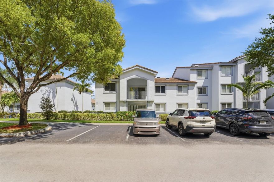 Enjoy beautiful water views from this refreshed 3-bedroom, 2-bath residence in the sought-after Royal Grand community, ideally positioned on the interior side of the community away from the main road and parking areas. Designed for comfortable living, the home features a bright, open layout with vaulted ceilings and a split-bedroom floor plan that offers both space and privacy. Natural light fills the living areas, creating a warm and inviting atmosphere throughout. The updated kitchen includes granite countertops, stainless steel appliances, and ample storage, all complemented by porcelain tile flooring throughout. The spacious primary suite offers three closets, direct access to the balcony, and an updated bathroom with a glass-enclosed shower and modern vanity. Hurricane impact windows and sliding doors provide added security, energy efficiency, and a quiet interior environment. Royal Grand offers a full range of amenities, including a clubhouse, pool, fitness center, multi-use tennis, basketball, and pickleball court, an indoor racquetball court, a billiard room, and a fenced dog run. Residents enjoy a well-maintained community with lush landscaping and a welcoming environment. Located within walking distance to NSU, shopping, dining, and major retailers like Whole Foods and Trader Joe’s, with easy access to highways, Fort Lauderdale Airport, downtown, and the Everglades. Community has been recently painted, and features updated roofing, adding to the overall value.