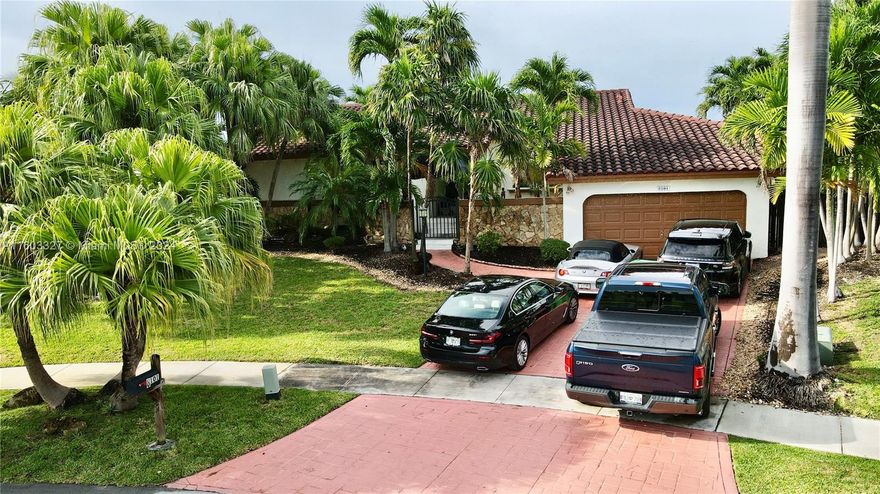 Discover your dream tropical oasis! Enjoy stunning sunsets from this lakefront 5-bedroom, 3-baths home. It features a converted garage on a large lot. Private dock and enjoy the peaceful lake views from every room. This property includes a cabana and dock for beautiful lakefront evenings, spacious pool overlooking the lake perfect for relaxation and entertaining. The kitchen has tile floors, custom cabinets, stainless steel appliances, and a large bar for ample seating. The cozy family room features a wood-burning fireplace for extra warmth. With a 10-year-old roof and a private well, this home combines convenience with peace of mind. It's located near a park, tennis courts, a play area, and Black Point Marina. The owner notes the living area is 3000sf, larger than public records indicate