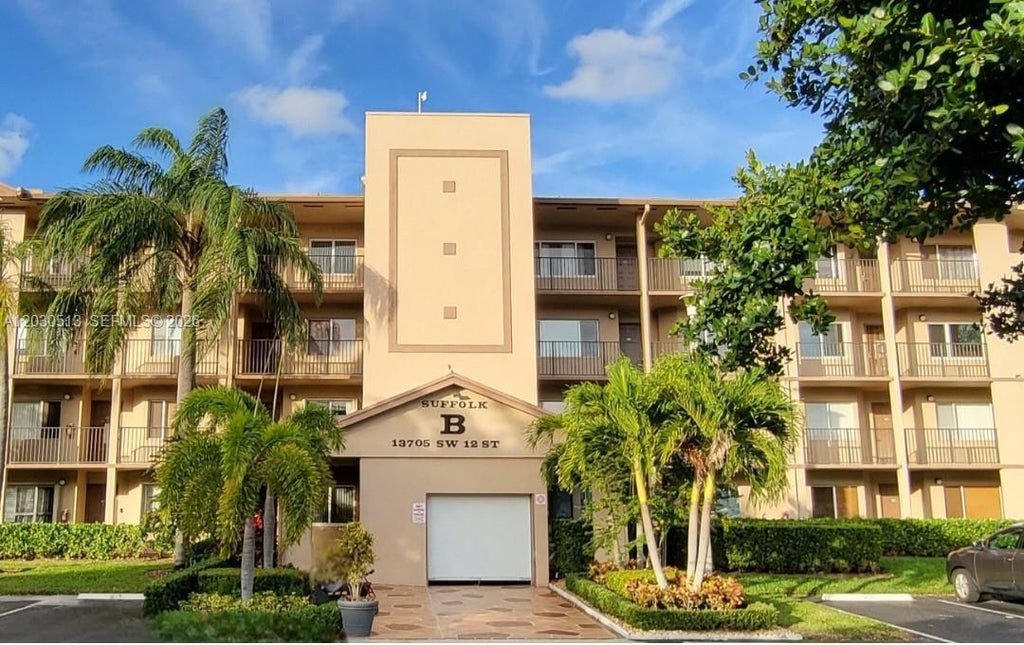 Photo of 13705 SW 12th St #304B, Pembroke Pines, FL 33027 (MLS # A12030513)