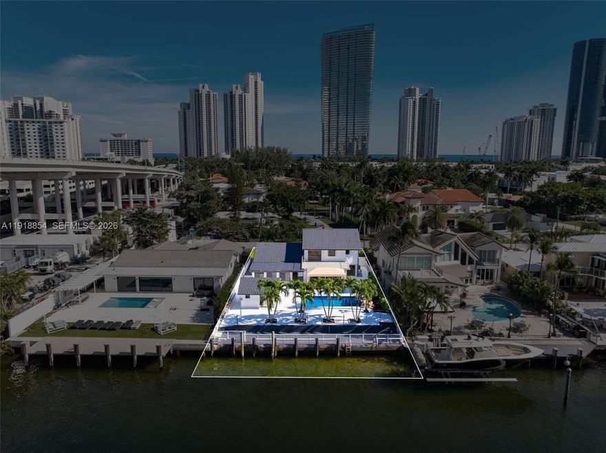 WATERFRONT GEM IN THE HEART OF GOLDEN SHORES, SUNNY ISLES! This beautifully maintained home offers 75 feet of prime water frontage and a private dock—perfect for enjoying the coastal lifestyle. Featuring 4 spacious bedrooms and 3 bathrooms, the home includes a formal dining room, breakfast area, Florida room, and an oversized heated pool overlooking the Intracoastal. Take in breathtaking sunset views from your backyard oasis. Additional highlights include an oversized circular driveway, generous living spaces, and incredible natural light throughout.