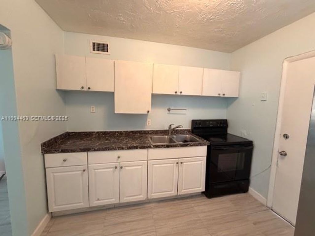 Photo of 5693 Fletcher St #1-2, Hollywood, FL 33023 (MLS # A11994463)