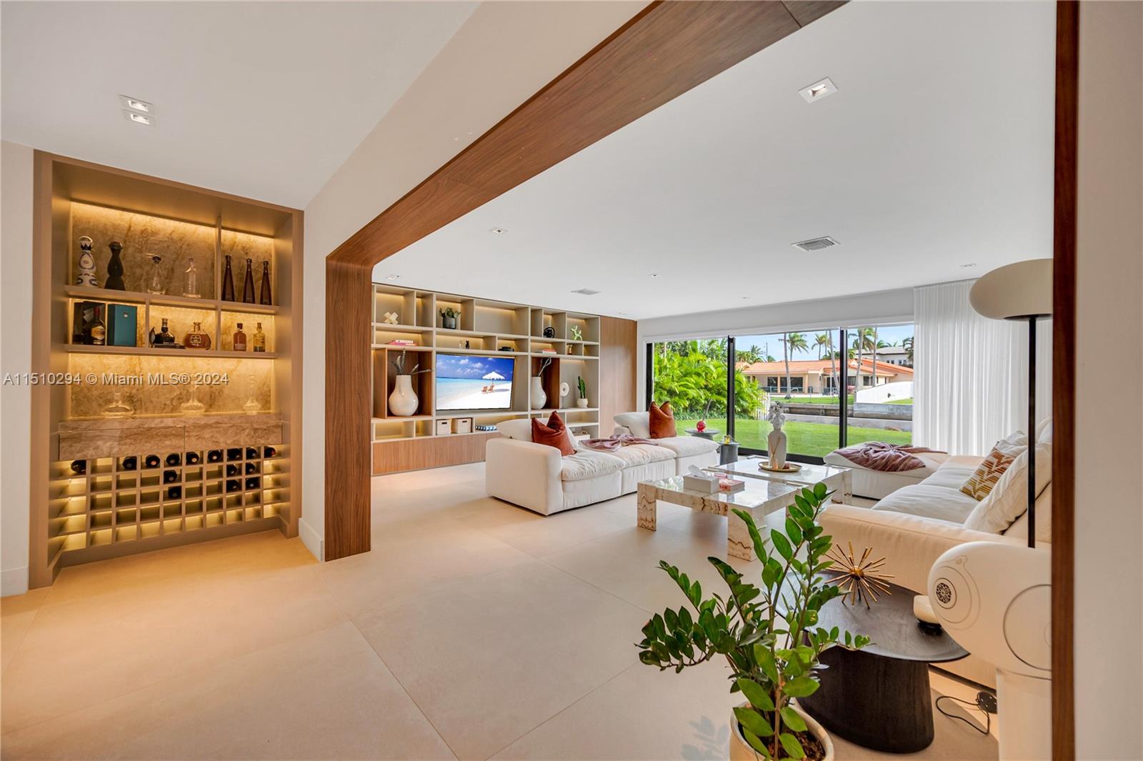 Fully renovated home in the exclusive Biscayne Point Island community with luxurious features.
Welcome to this exquisite fully renovated house, where elegance meets comfort. This stunning property boasts two spacious bedroom suites with separate bathrooms, offering privacy and spacious closets.
There are 2 additional bedrooms with full closets and a shared bathroom.
Step into the heart of the home and be captivated by a welcoming salon, large dining area and newly installed kitchen equipped with top of the line appliances by Porcelanosa.
The living room features a beautifully custom-designed bookcase, which adds a touch of sophistication to the space overlooking a large garden area and the canal.