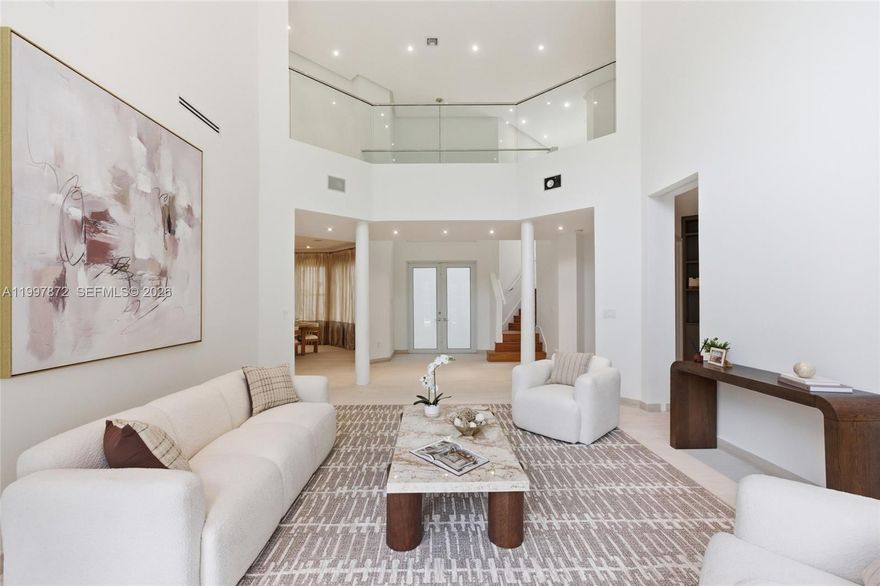 Introducing this one-of-a-kind property in the prestigious gated community of Country Club Estates, Aventura. This extraordinary residence stands out as one of the largest in the area, sitting on an expansive lot of nearly 10,000 sqft and offering over 5,000 sqft of living space. The home features 5 spacious bedrooms, each with its own ensuite bathroom, plus a total of 6.5 baths. Elegant limestone floors adorn the lower level, while warm wood flooring enhances the second floor. The stunning exterior includes a large driveway, a covered two-car garage, and a beautifully designed patio with a covered terrace, pool, and jacuzzi—perfect for entertaining. Properties of this size and caliber are truly rare in Aventura. Don’t miss this unmatched opportunity!