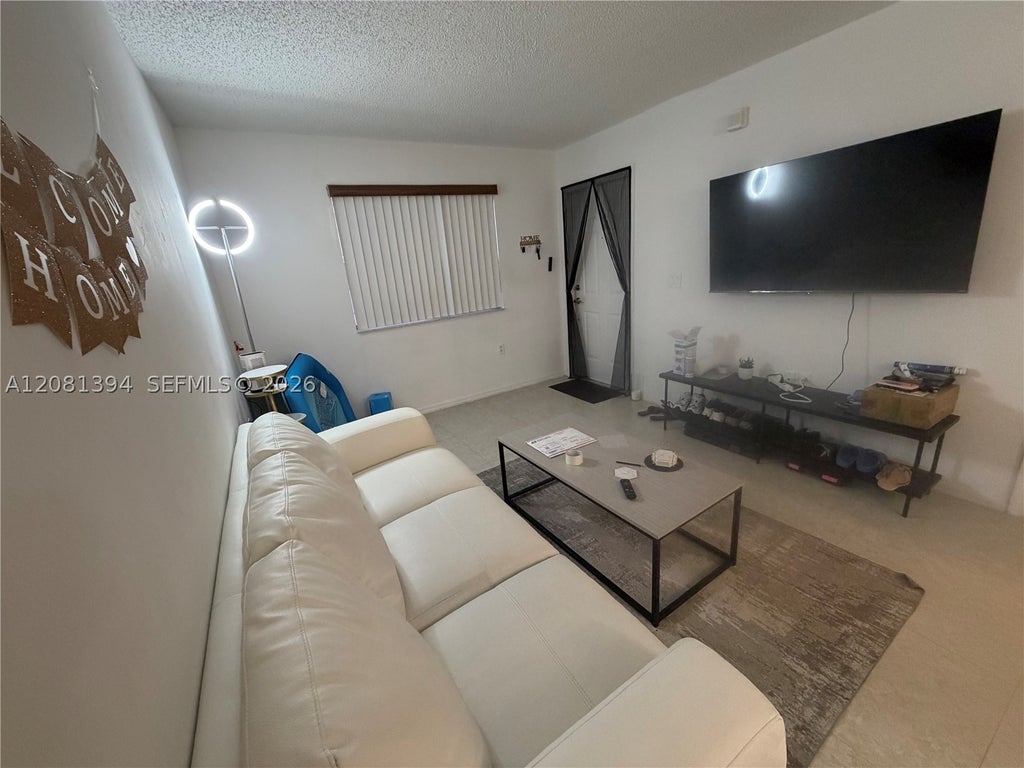 Photo of 7775 NW 22nd St #105, Pembroke Pines, FL 33024 (MLS # A12081394)