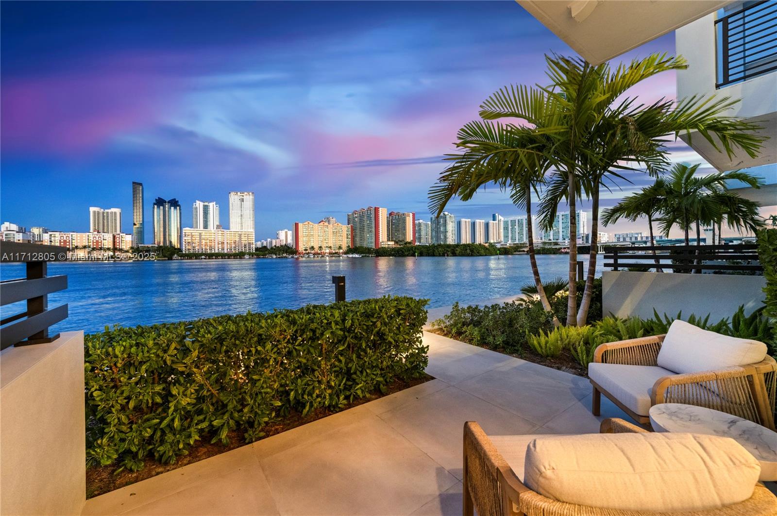 Experience the pinnacle of waterfront luxury with this Spectacular Koya Bay Aura Model with a private boat dock accommodating up to a 30-foot vessel. No detail has been overlooked in the thoughtfully designed upgrades, including wood flooring throughout, Wolf appliances, Sub-Zero refrigerator, gourmet kitchen with quarts counter tops. Luxurious primary suite with gorgeous spa bath, amazing 4th-floor bonus space features an oversized balcony and a 4-person Jacuzzi, perfect for entertaining or relaxing while enjoying breathtaking views. Floor-to-ceiling impact glass with stacking doors seamlessly merges indoor and outdoor living. This home is perfect for entertaining offering a majestic Miami lifestyle second to none. Live the Koya Bay life in complete tranquility.