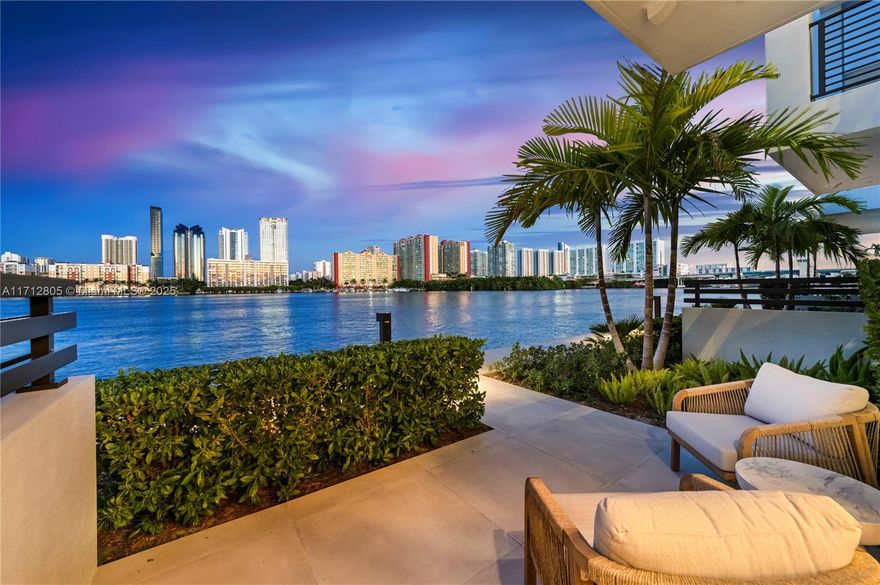 Experience the pinnacle of waterfront luxury with this Spectacular Koya Bay Aura Model with a private boat dock accommodating up to a 30-foot vessel. No detail has been overlooked in the thoughtfully designed upgrades, including wood flooring throughout, Wolf appliances,  Sub-Zero refrigerator, gourmet kitchen with quarts counter tops. Luxurious primary suite with gorgeous spa bath, amazing 4th-floor bonus space features an oversized balcony and a 4-person Jacuzzi, perfect for entertaining or relaxing while enjoying breathtaking views. Floor-to-ceiling impact glass with stacking doors seamlessly merges indoor and outdoor living. This home is perfect for entertaining offering a majestic Miami lifestyle second to none. Live the Koya Bay life in complete tranquility.