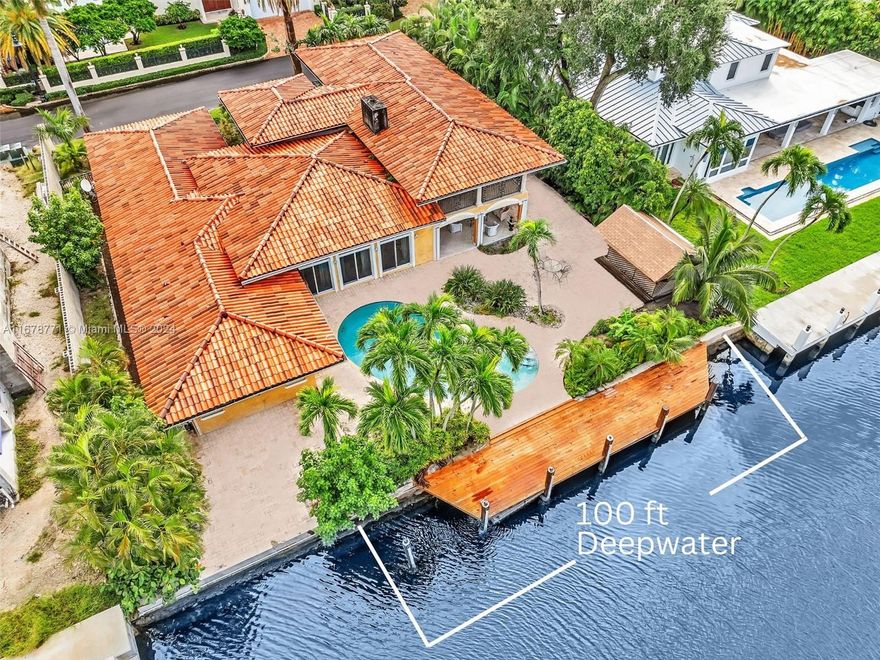 Spectacular Las Olas Mediterranean estate with 100' prime deep water frontage perfectly accommodates up to a 90' yacht. This 5-bedroom, 4-bath residence is a boater's dream, offering quick ocean access and the convenience of a large dock. The home features a custom-designed chef's kitchen, soaring 12' ceilings, and an open great room with expansive arched windows that flood the space with light and offer stunning pool and waterway views. The primary suite includes a private terrace overlooking the water and a luxurious his-and-hers bath. Located on an exclusive 12,999 sqft lot on Isle of Palms off Las Olas, this home is perfect for boating enthusiasts, with direct access to the Intracoastal and only minutes to the ocean—steps to the Beach and Las Olas Blvd.