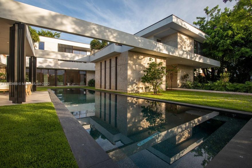 Welcome to Casa Poinciana. You’ll feel you’ve arrived at your own private resort in this spectacular newly-constructed Bay Point Modern Tropical pool home compound. With clean sleek elegant lines and cool “C” shape design, this designer masterpiece delivers paramount luxurious living with over 6,700+ SF of interiors and extensive covered entertainment terraces wrapped around the sparkling 54.5-foot pool, summer kitchen and courtyard. Spacious and serene with flowing living, dining, grand media room; 10 ft ceilings; luminous window walls throughout; beautiful gourmet chef’s kitchen with 13 ft eat-in island; separate breakfast room; a huge main suite retreat with enormous walk-in closet, spa-like bath and hammered copper soaking tub; plus abundant parking. Welcome to your own private oasis!