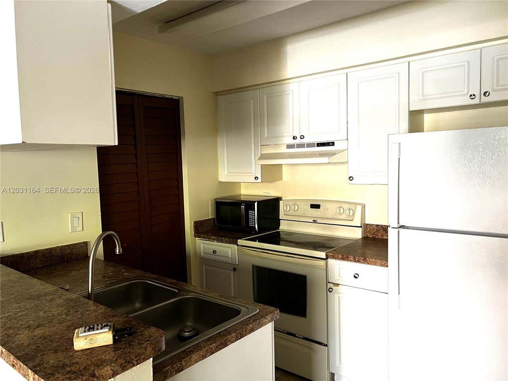 Photo of 1239 SW 46th Ave #905, Pompano Beach, FL 33069 (MLS # A12031164)