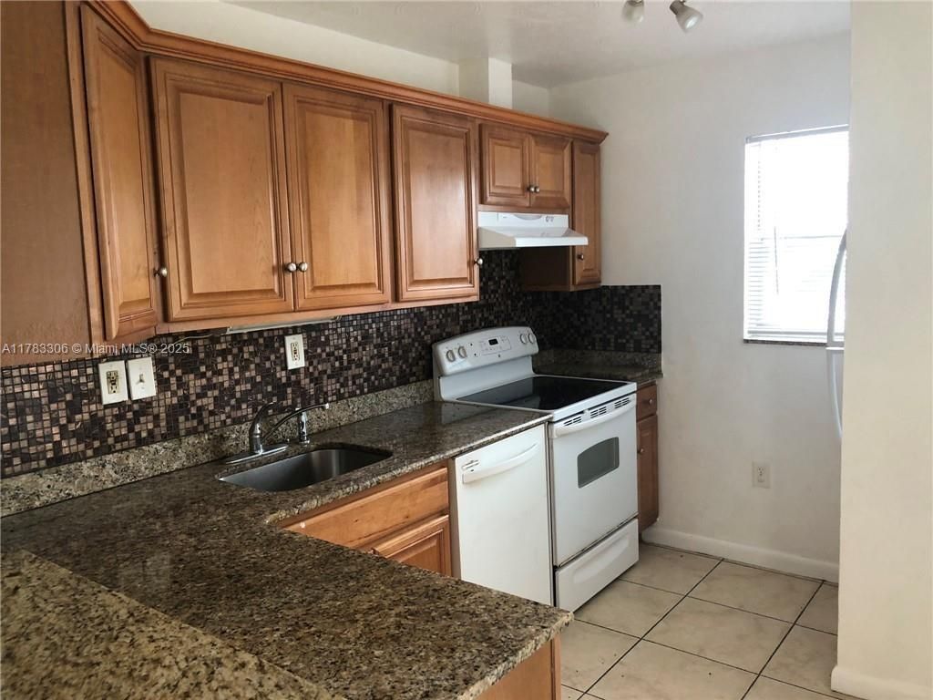 Photo of 1021 NW 45th St #4, Deerfield Beach, FL 33064 (MLS # A11783306)