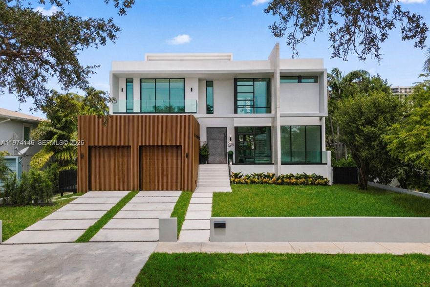 Experience bayfront luxury in this 2026 NEW CONSTRUCTION waterfront masterpiece in exclusive Miami Shores-East. Designed by FAO Architecture and built by Barreto Constructions for Setasi Developers, this contemporary estate blends sophisticated design with serene waterfront living—just under one minute to the open bay with no fixed bridges.

Offering 6,621 total Sq Ft and 4,938 Sq Ft of interior space, the residence features 4 bedrooms, 4.5 designer baths, a fully integrated smart-home system, and an Italian Mia Cucina kitchen. The primary suite offers a private terrace, dual walk-in closets, and a spa-inspired bath.

Interior highlights include impact glass, a floating staircase, temperature-controlled wine cellar, and elegant Spanish tile finishes.

Outdoors, enjoy 75 ft of water frontage, heated pool and spa, summer kitchen, expansive terraces, and a rooftop lounge with stunning sunset and Miami skyline views.

Located in the sought-after Miami Shores golf community, minutes from top schools, Miami Shores Country Club, Bal Harbour Shops, and premier dining and culture.

Partially furnished and move-in ready, this home delivers refined waterfront living with effortless bay access.