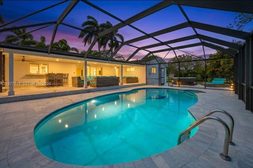 Set on an expansive 34,848 SF lot, this beautifully renovated and fully gated 4 bed 2 bath home offers a rare sense of space, privacy, and seclusion. Inside, the home features a convenient floor plan with bright open living space, impact windows and doors, upgraded flooring, custom closets and a multi-use 2 car garage. The chef’s kitchen is equipped with a Viking 6-burner gas range, double ovens, quartzite countertops, four pantries, a custom-made coffee station and a reverse osmosis system.
Outdoor living shines with a heated pool, and jacuzzi, screened lanai, covered patio, and over 2,000 SF of travertine pool deck, perfect for entertaining or relaxing. The lush grounds include mature fruit trees—lychee, avocado, two mango trees, star fruit, and banana trees, creating a true backyard oasis. Plenty of room for your boat and/or RV and with easy access to Biscayne National Park, Black Point Marina, and the Florida Keys. The home enjoys a peaceful setting providing the kind of breathing room that’s increasingly hard to find, while still being minutes from main attractions and highways. Easy to show.