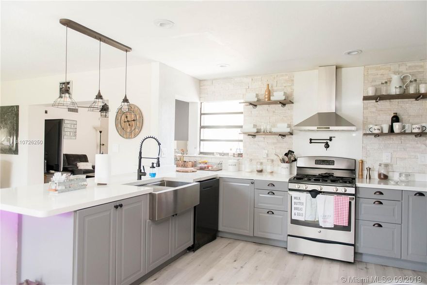 Sellers Motivated! The moment has come and the amazing opportunity to live in the highly desirable community of Palm Springs North is here. This completely remodeled home is full of upgrades and has the most incredible kitchen with stainless steel appliances, wood floors throughout, remodeled bathrooms, a bar area with built in wine cooler, cabinet and kegerator, and backyard with a pool ready to entertain family and friends. The property is centrally located with access to I-75, Florida Turnpike, and Palmetto Expressway. Close to shopping centers and restaurants. Schedule a showing quick, will not last!