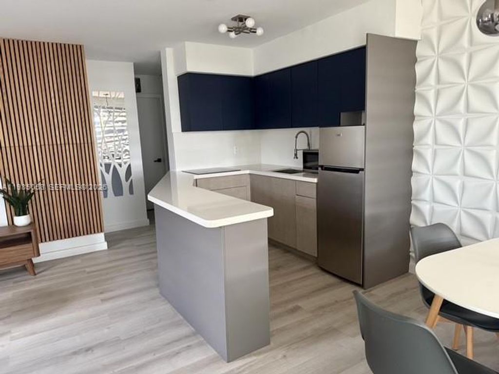 Photo of 2624 NE 30th Pl #101B, Fort Lauderdale, FL 33306 (MLS # A11985053)