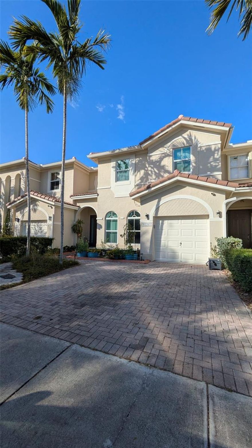 Must-see updated townhouse in the highly desirable Kendall Breeze community! This spacious 1,746 sq. ft. residence features 3 bedrooms and 2.5 bathrooms, seamlessly blending style and functionality. The home offers an open-concept layout filled with abundant natural light, highlighted by a modern kitchen with granite countertops, a new contemporary backsplash, and stainless-steel appliances. Major upgrades provide peace of mind, including all-new impact windows and sliding doors (2022), a new A/C, and a brand-new roof (2025). Additional improvements include a renovated laundry closet with new washer and dryer and a permitted EV charger in the garage. Step outside to a private, fenced patio featuring lush native plants and fruit trees—perfect for relaxing or entertaining. Kendall Breeze offers exceptional amenities, including 24/7 security patrol, a clubhouse, gym, recreational areas, and two tot lots. The neighborhood is safe, walkable, and ideally located near major highways, top-rated schools, upscale shopping, and dining. Enjoy the convenience of being just 30 minutes from South Beach and 40 minutes from the Florida Keys. 
With low maintenance fees and outstanding community features, this home delivers exceptional value. Whether you’re upsizing, downsizing, or simply seeking a fresh start, this townhouse is ready to welcome you home.