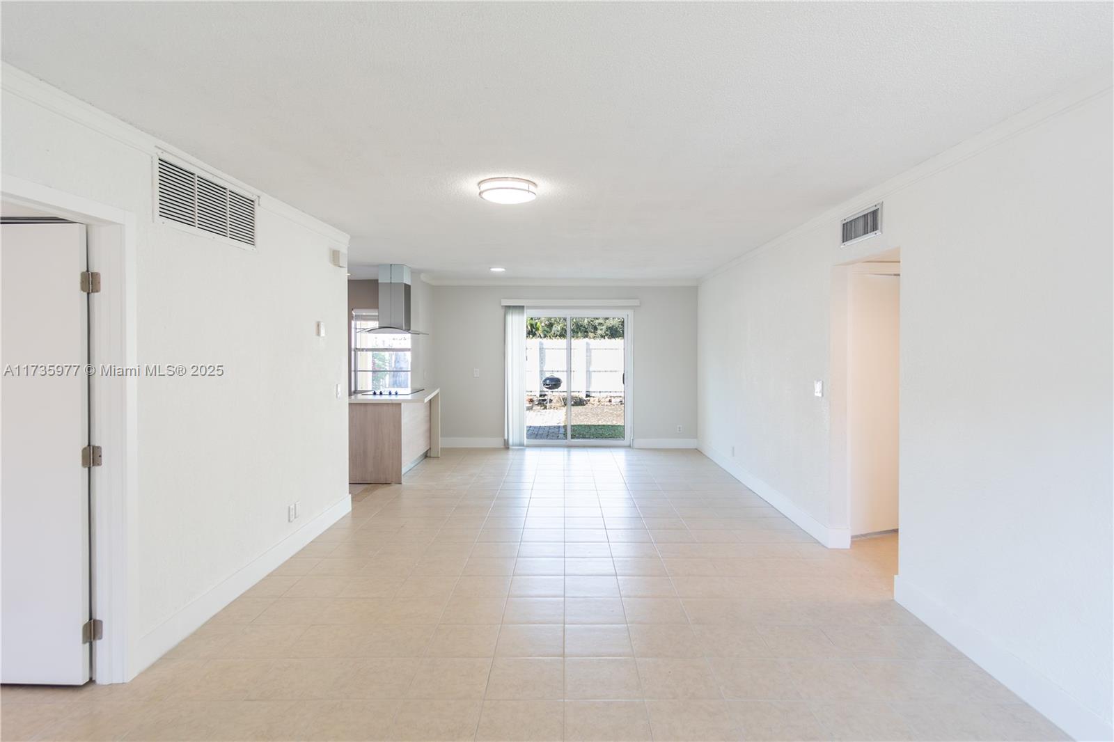 Exceptional villa in Palm Aire Village! This spacious 3-bed, 2-bath home (huge den can totally serve as a 3rd bed) offers brand new finishes, a private fenced yard, and 3 parking spaces right in front. Enjoy a modern kitchen with granite countertops, lacquer white & wood cabinetry, and updated appliances. Bathrooms completely remodeled, showcasing enclosed showers with luxurious designer tile, fixtures, and sophisticated finishes. Unit includes washer and dryer. Enjoy the privacy of a fenced backyard, perfect for relaxing or entertaining. Recently updated roof & 2024 A/C. Low HOA covering water, sewer, yard & exterior maintenance, plus roof reserves make this a fantastic value. Conveniently located minutes from I-95, this pet-friendly home is move-in ready! Rentals OK after purchase.