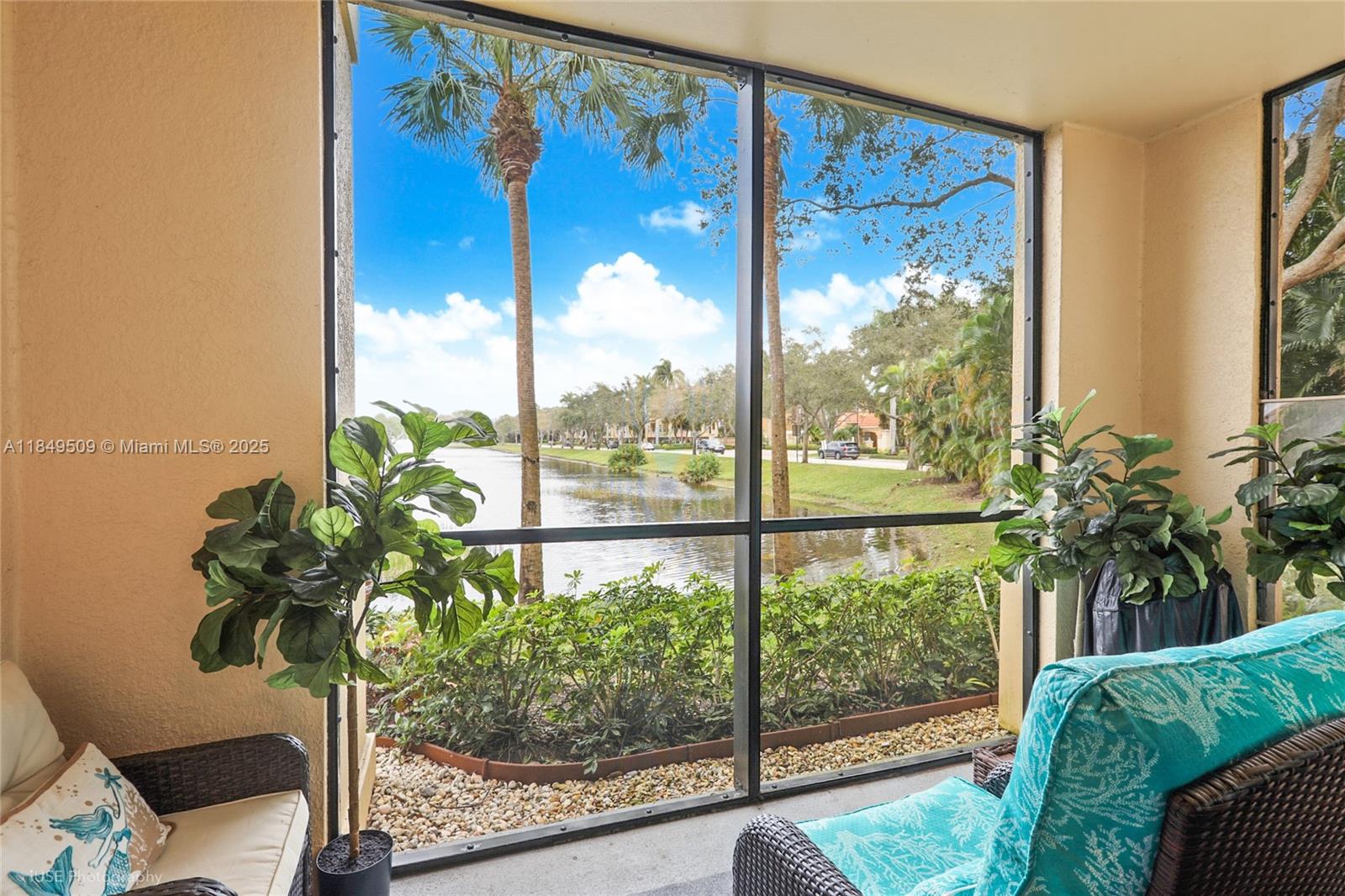LAKE VIEWS FROM EVERY ROOM! Welcome to your charming fully furnished ground floor 1-bedroom condo in the gated resort-like community of San Matera. The open-concept living area seamlessly connects the living room, dining space, and kitchen, leading to a generous porch. A Murphy Bed converts the dining area to a guest bedroom. Unit measures bigger than tax roll. New stainless steel appliances including refrigerator, range, dishwasher, washer & dryer, new a/c and water heater. High Impact windows throughout. The gated community provides added security and a host of amenities, including landscaped grounds, a swimming pool & fitness center that is centrally located to many restaurants, the Gardens Mall and very close to airport, I95 & turnpike. Available now! Call today!