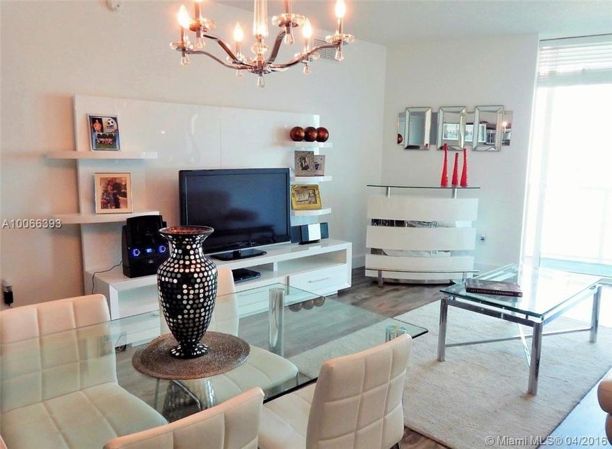 BREATHTAKING BAY VIEWS IN THIS TWO BEDROOM WITH TWO FULL BATHS DESIGNED WITH SLATE FLOORS & FRAMELESS GLASS SHOWER DOOR, GREY WOOD FLOORING THROUGHOUT, FLOOR TO CEILING WINDOWS & BALCONY ACCESS FROM EVERY ROOM. BUILDING OFFERS CONCIERGE SERVICE, VALET PARKING, A THEATER, BILLIARD ROOM, MARKET, TWO SWIMMING POOLS, TWO-STORY FITNESS CENTER & SAUNA ROOM. WALKING DISTANCE TO PARKS, SHOPPING & VERY CLOSE TO DESIGN DISTRICT, MIDTOWN, BRICKELL & SOBE.