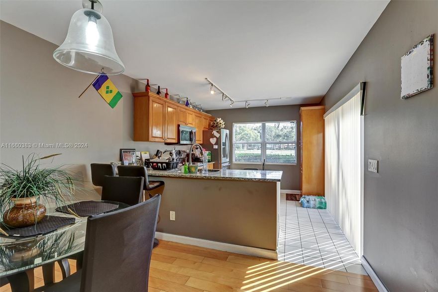 Situated in a serene cul-de-sac, this home offers an ideal environment for family living and pets. The screened patio overlooks a peaceful expanse of lush greenery, creating a private outdoor oasis. Residents enjoy access to premium community amenities, including a pristine pool and tennis courts. With its prime location near downtown, shopping, and PBI Airport, this residence perfectly blends tranquility with convenience. The owner is highly motivated, presenting a rare opportunity for discerning buyers.