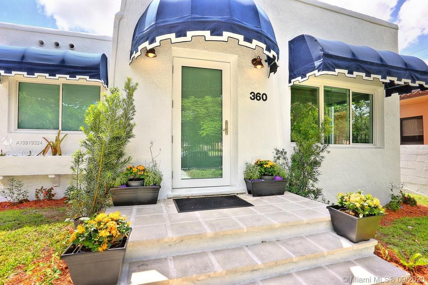 Lovely gated home in The Roads, a quiet neighborhood with tree-lined streets. Located just minutes to Downtown Miami, Brickell, Key Biscayne, Coconut Grove, Coral Gables & the Beaches.  Totally renovated with new wood flooring, kitchen, bathrooms, roof & impact glass throughout. Light-filled living spaces with a neutral color palette create a blending of original architectural details with a modern aesthetic. European-style custom kitchen features quartz countertops & stainless appliances. Special features include entry foyer/den, living room with stone fireplace + large formal dining room. Expansive back garden with potential to enlarge the home and to add a pool. Close to MIA & I-95 for easy access throughout South Florida.